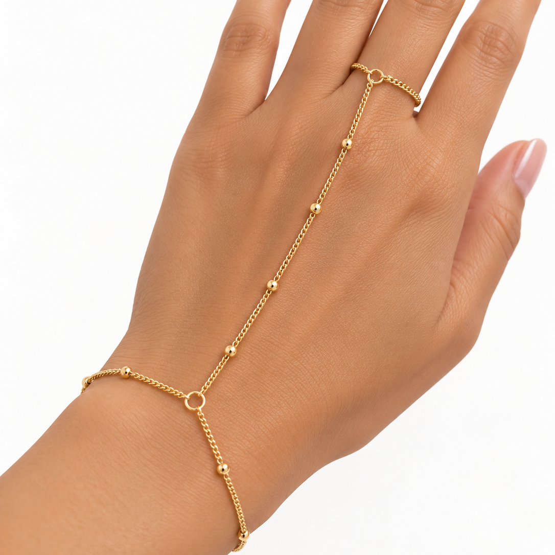 Gold beaded hand chain with finger loop, lobster clasp, and adjustable extension chain model