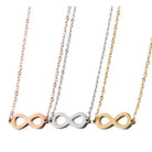 Infinity necklace in gold and silver showcasing three variations in different metals, representing eternal love.