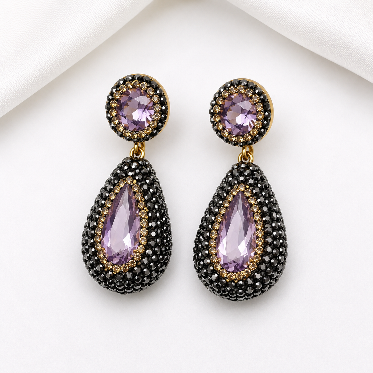 Nano stone pendant earrings in purple with black pavé rhinestones and gold accents, showcasing luxury and elegance.