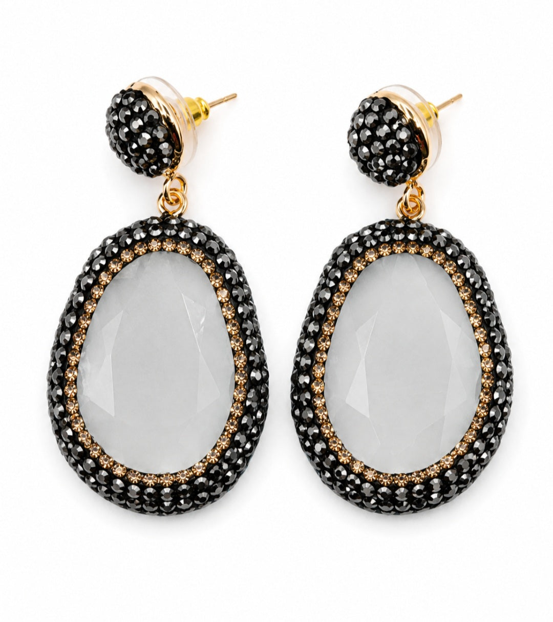 Myra stone pendant earrings featuring a clear stone surrounded by sparkling rhinestones and gold accents.
