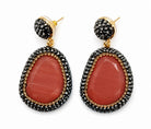Myra stone pendant earrings featuring a stunning red stone pendant with sparkling rhinestones and gold accents.