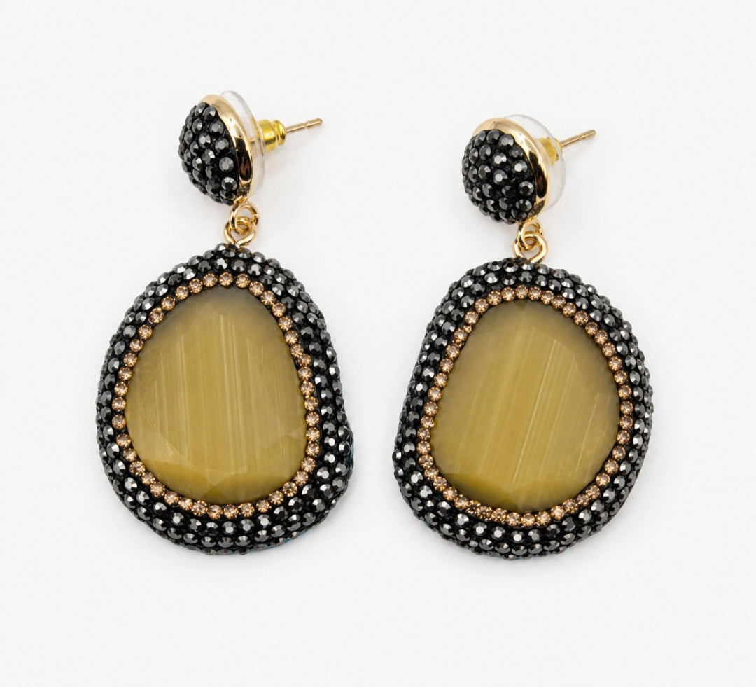 Myra stone pendant earrings featuring a unique yellow stone and decorative rhinestones in a black setting.