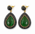 Nisa stone pendant earrings featuring green stone pendants surrounded by rhinestones on a gold plated setting.