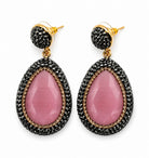 Nisa stone pendant earrings featuring pink stone and sparkling rhinestones, perfect for any occasion.