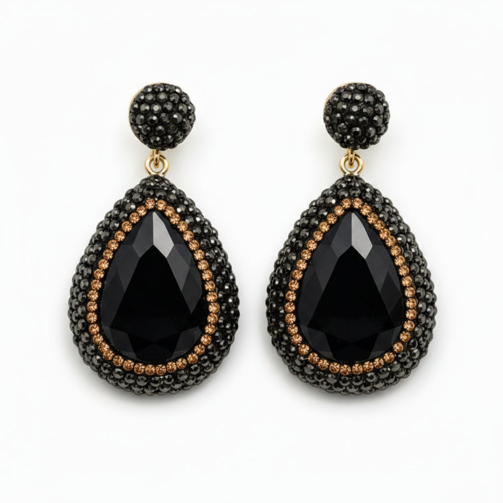 Mila black stone pendant earrings featuring large black crystals and rhinestones in a luxurious design.
