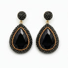 Mila black stone pendant earrings featuring large black crystals and rhinestones in a luxurious design.