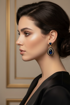 Mila black stone pendant earrings worn by a model showcasing elegance and style with a striking design.