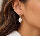 Gold-tone crystal stud earrings with oval white pearl drops  model