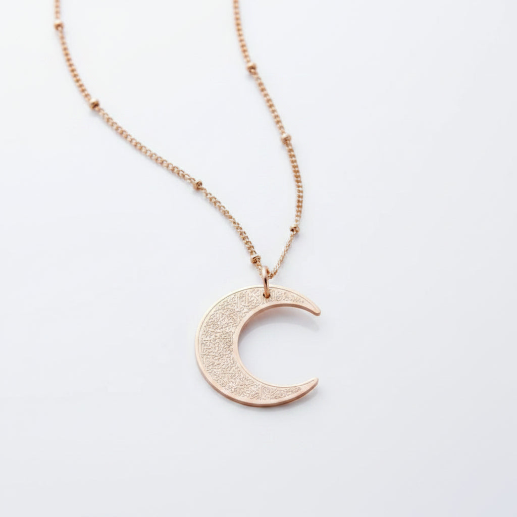 Ayatul Kursi necklace crescent with a shiny crescent pendant on a delicate chain.