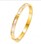 Grace Mother of Pearl Gold Bangle — 18k gold plated stainless steel bangle with mother-of-pearl inlays and CZ accents by Zoha Los Angeles