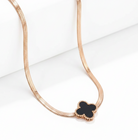NIDA charm necklace featuring a delicate black pendant on a rose gold chain, perfect for elegant layering.