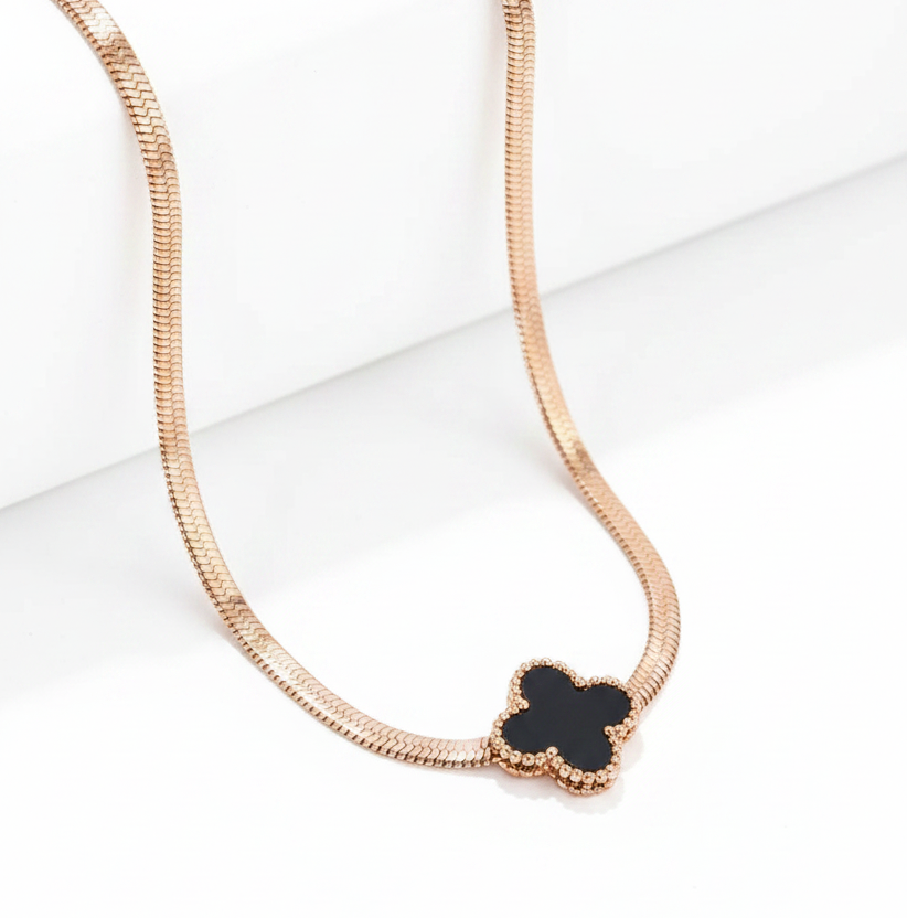 NIDA charm necklace featuring a delicate black pendant on a rose gold chain, perfect for elegant layering.