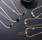 NIDA charm necklace showcasing intricate pendant designs in elegant gold tones, ideal for layering or wearing alone.