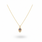 Geometric design necklace featuring a hand pendant with an eye motif and gold chain.