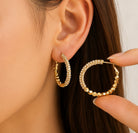 Nyla Hoop Earrings in gold - 18K gold plated stainless steel by Zoha Los Angeles